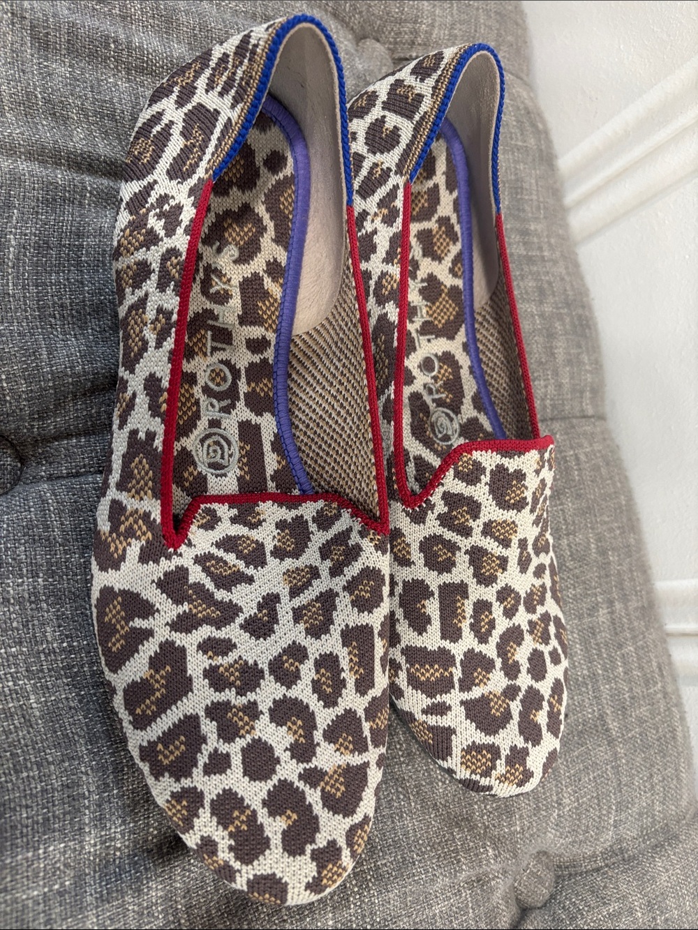 Rothy's Leopard Knit Slip-Ons with Red Trim and Blue Accent